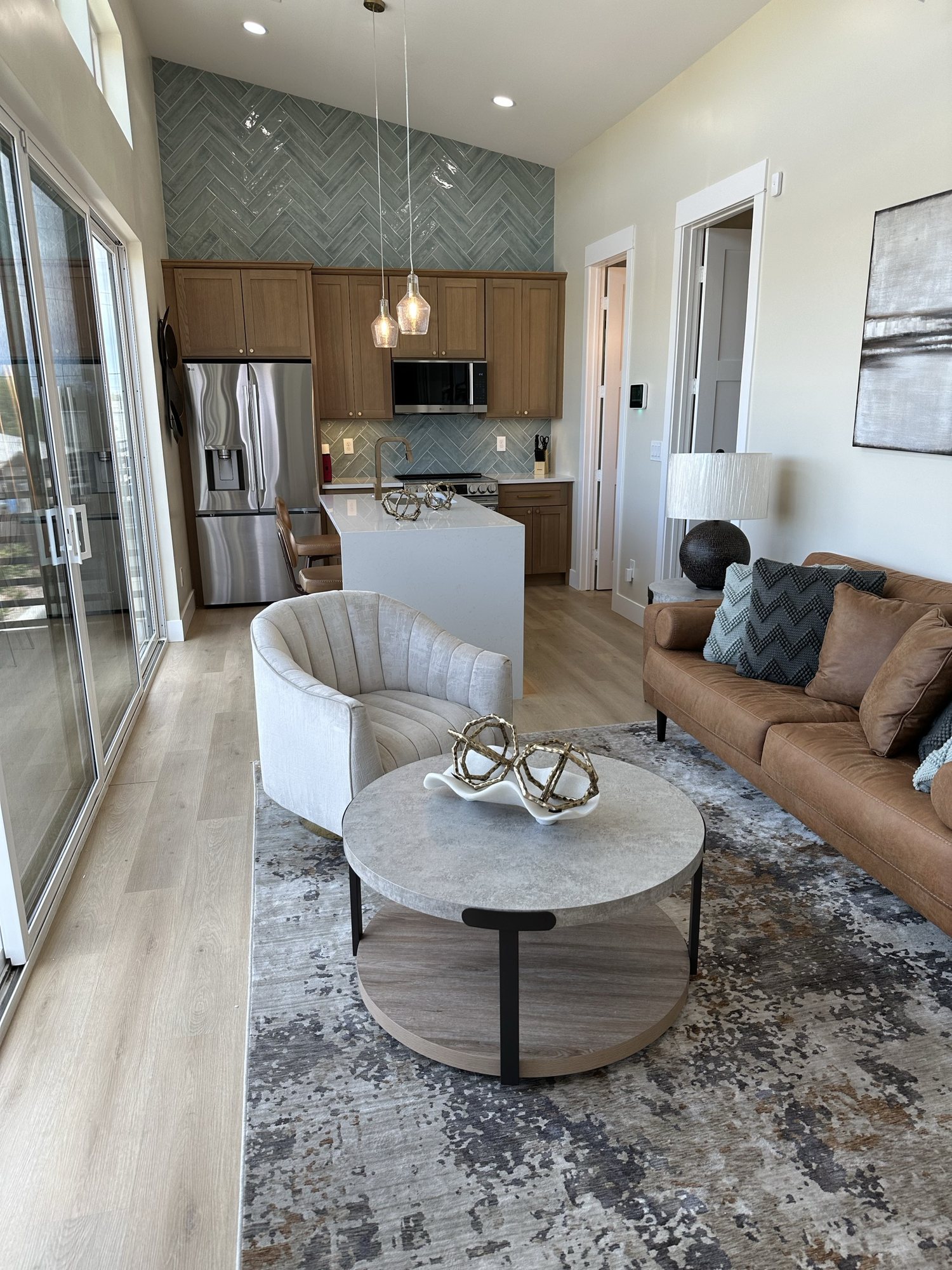 Furnished living room opening to the kitchen in Residence A